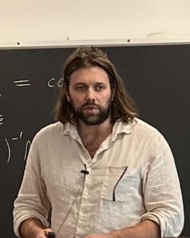 William R. Shoemaker, lecturing at a blackboard